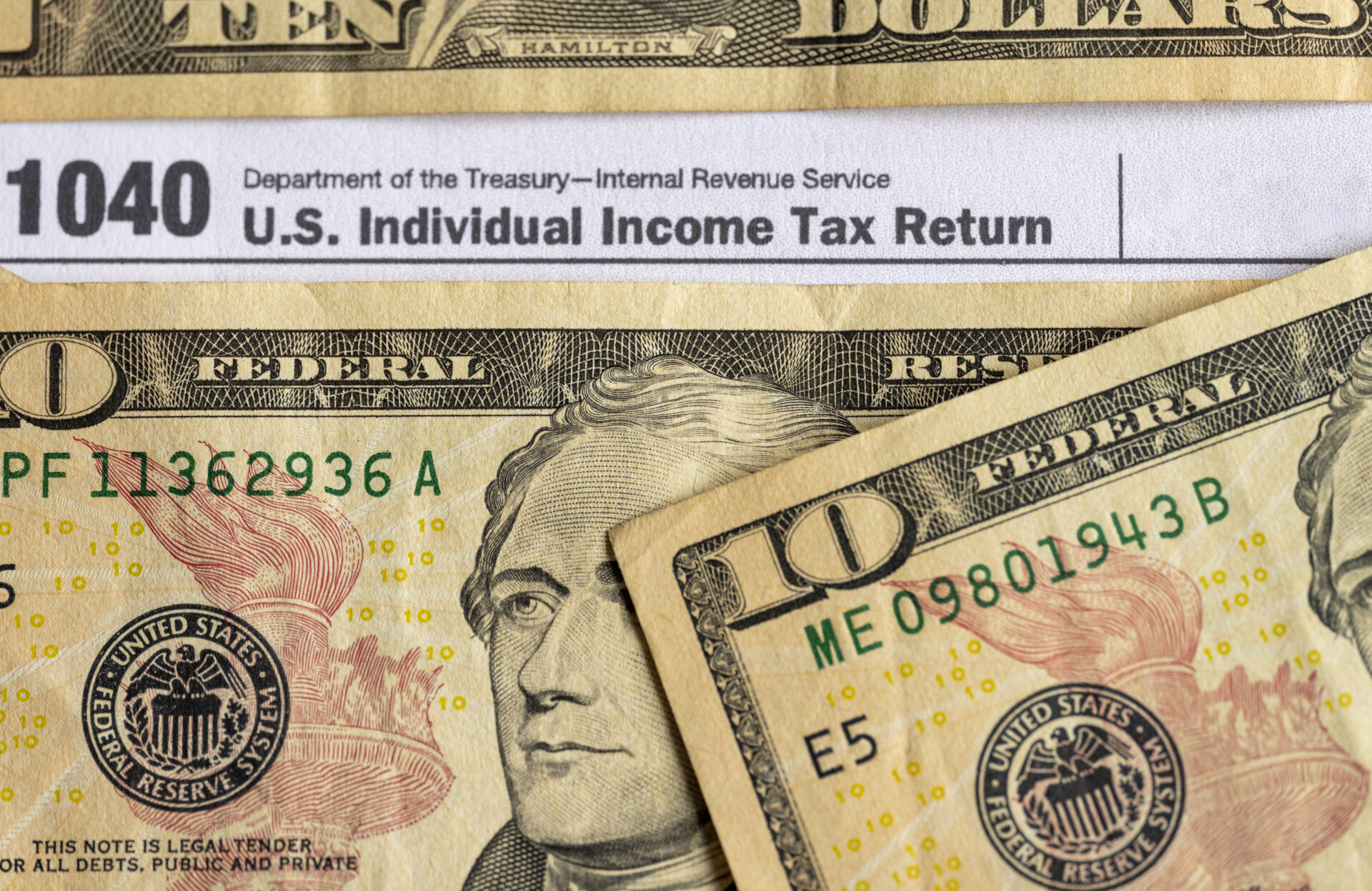 IRS form 1040 and dollars still life background.